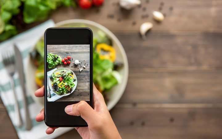 Nutritionist taking picture of their food