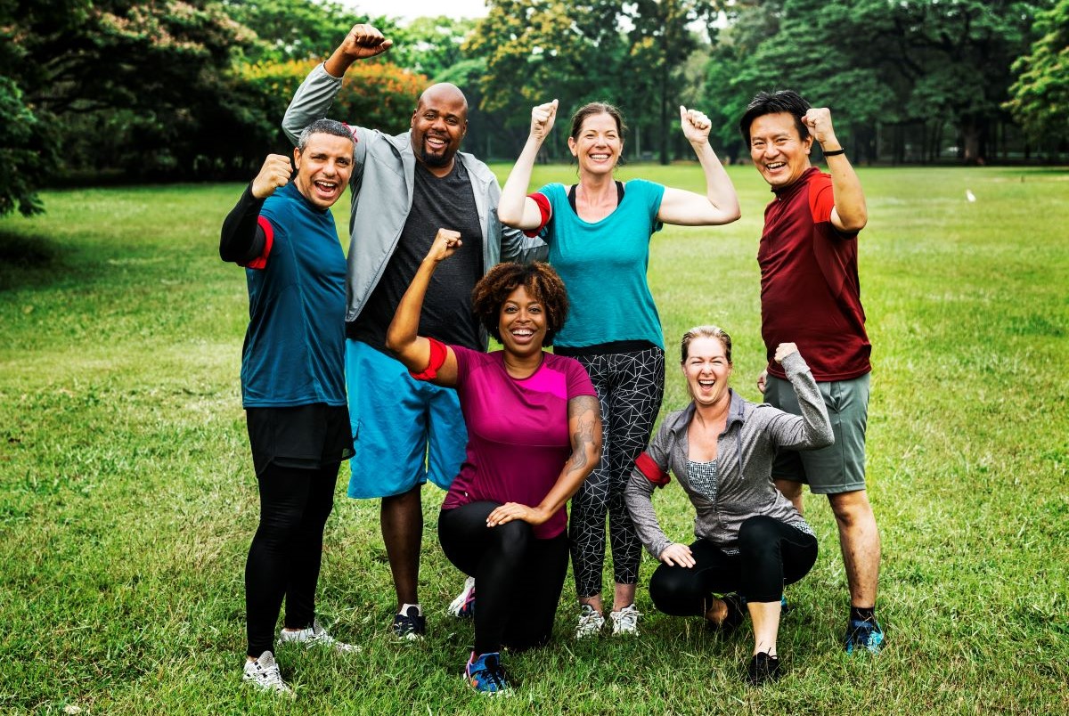 Group of cheerful diverse friends in the park